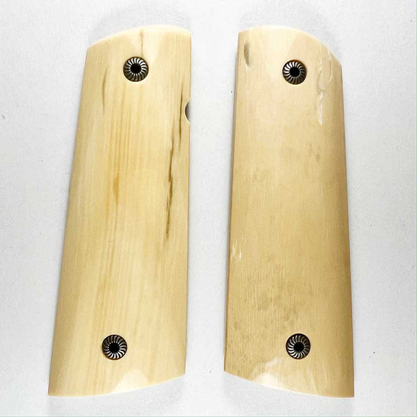 Mammoth ivory Nice light ivory color with good fine grain. The dark smudge seen on the left panel is not there, it is an optical illusion, what’s there is very faint and subtle or your money back. These look like elephant ivory and are a bargain at only $495. Glare is from the lights, screws shown are Swirls and not included, order separately.